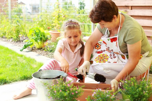 Gardening team assessing a front garden for safety